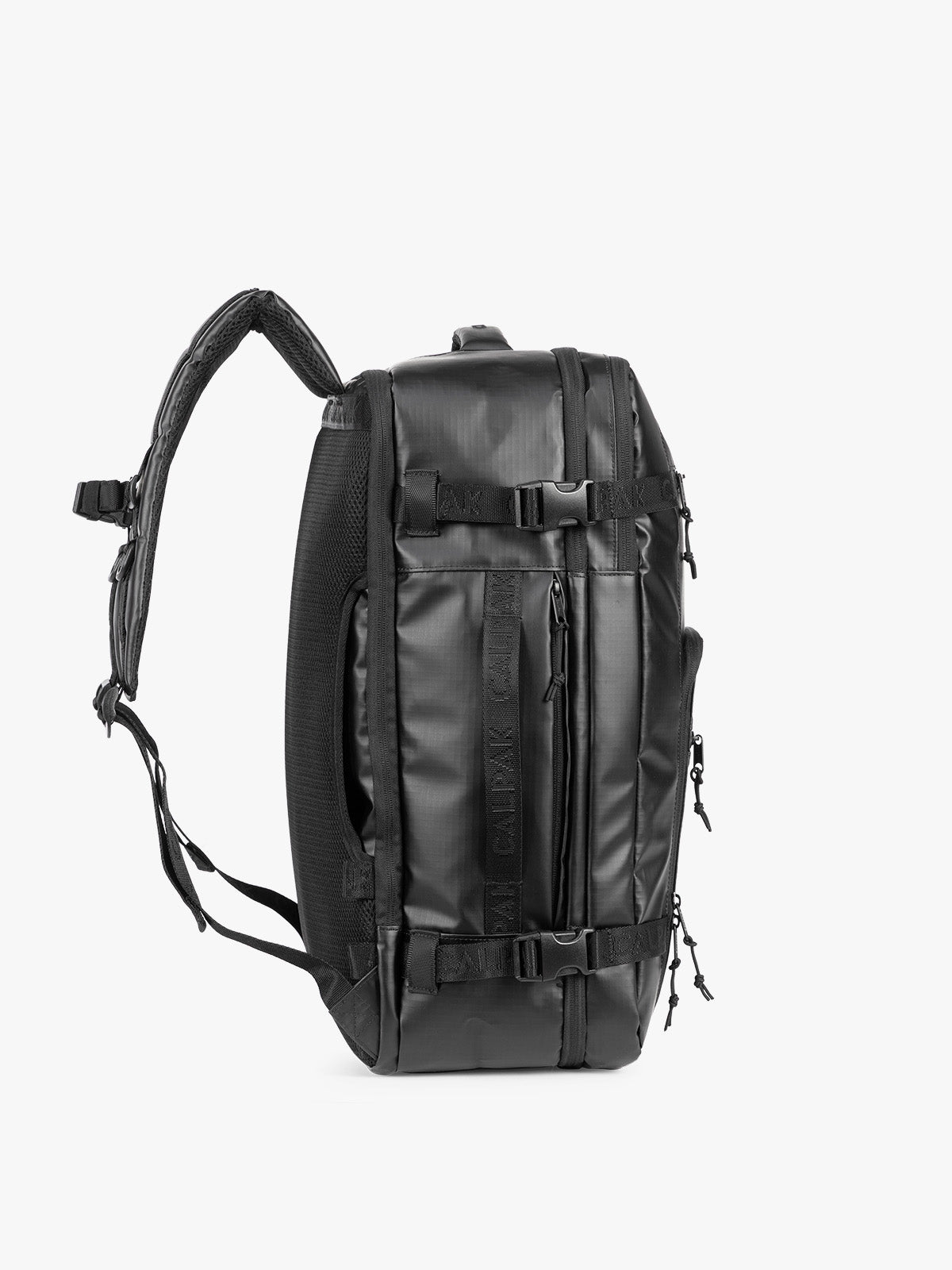 Side view of CALPAK Terra 35L Laptop Backpack Duffel in matte black Obsidian on a white background;  BPTL2601-MATTE-OBSIDIAN