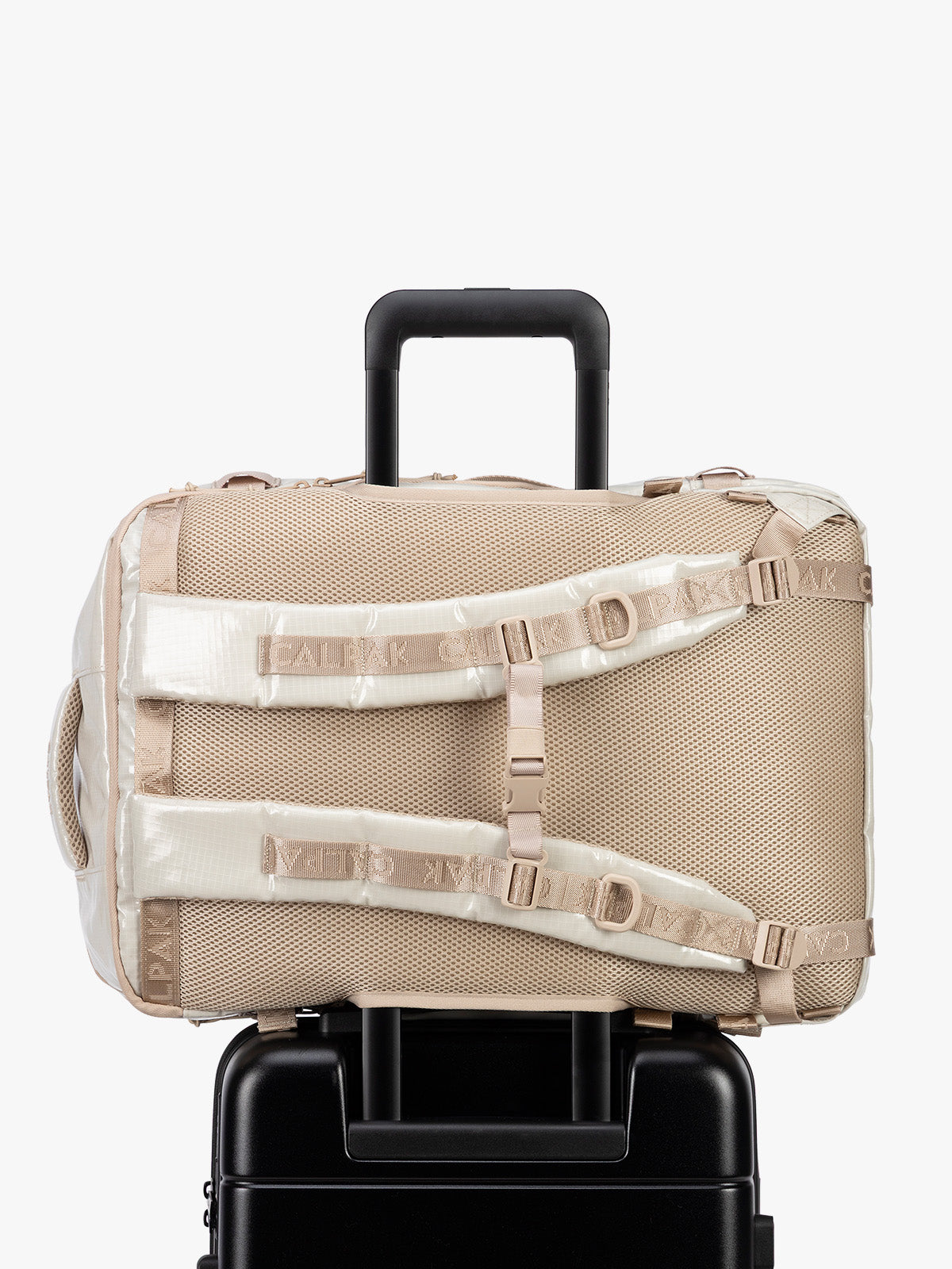 Back trolley sleeve of CALPAK Terra 35L Laptop Backpack Duffel in off-white White Sands with tan accents on a white background; BPTL2601-WHITE-SANDS
