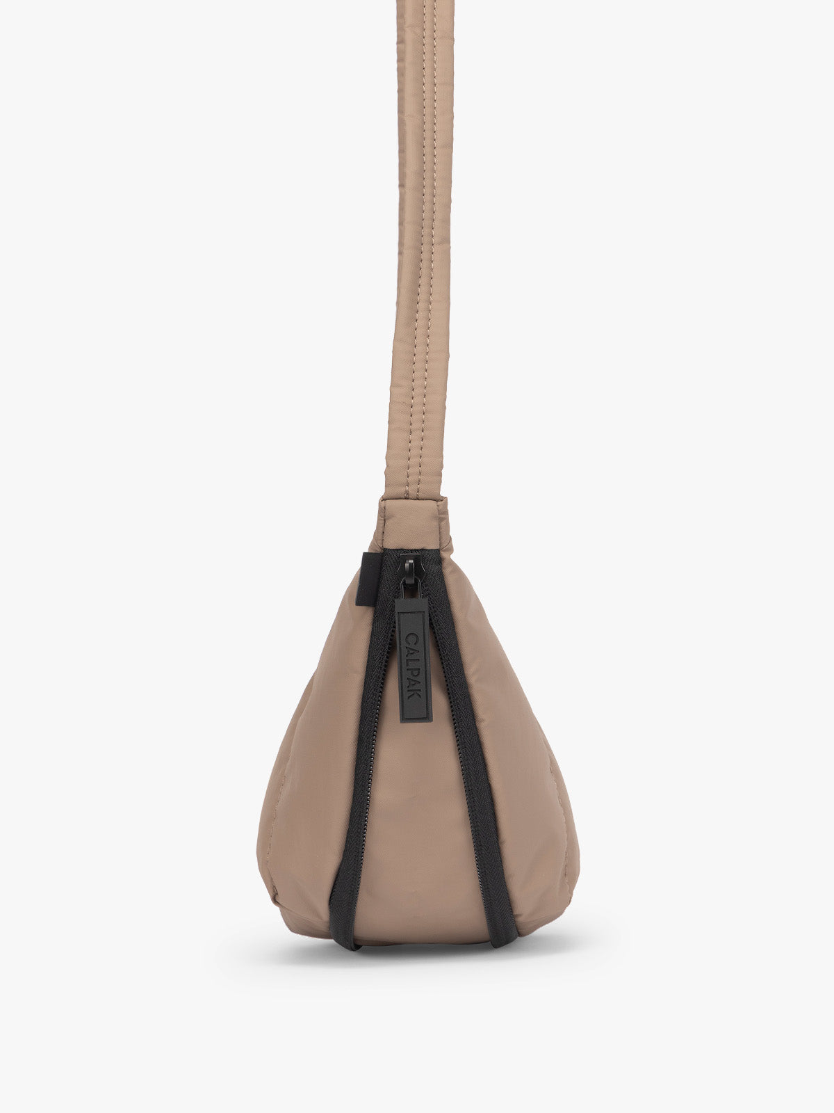 Side view showing expandable function of the CALPAK Luka Crescent Tote bag in light brown Chocolate with shoulder strap and bag is expandable up to 2"; CBL2601-CHOCOLATE