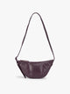 Dark Cherry deep burgundy vegan leather Luka Crescent shoulder bag with a long thin strap, shown against a plain light gray background; CBL2601-DARK-CHERRY-PU
