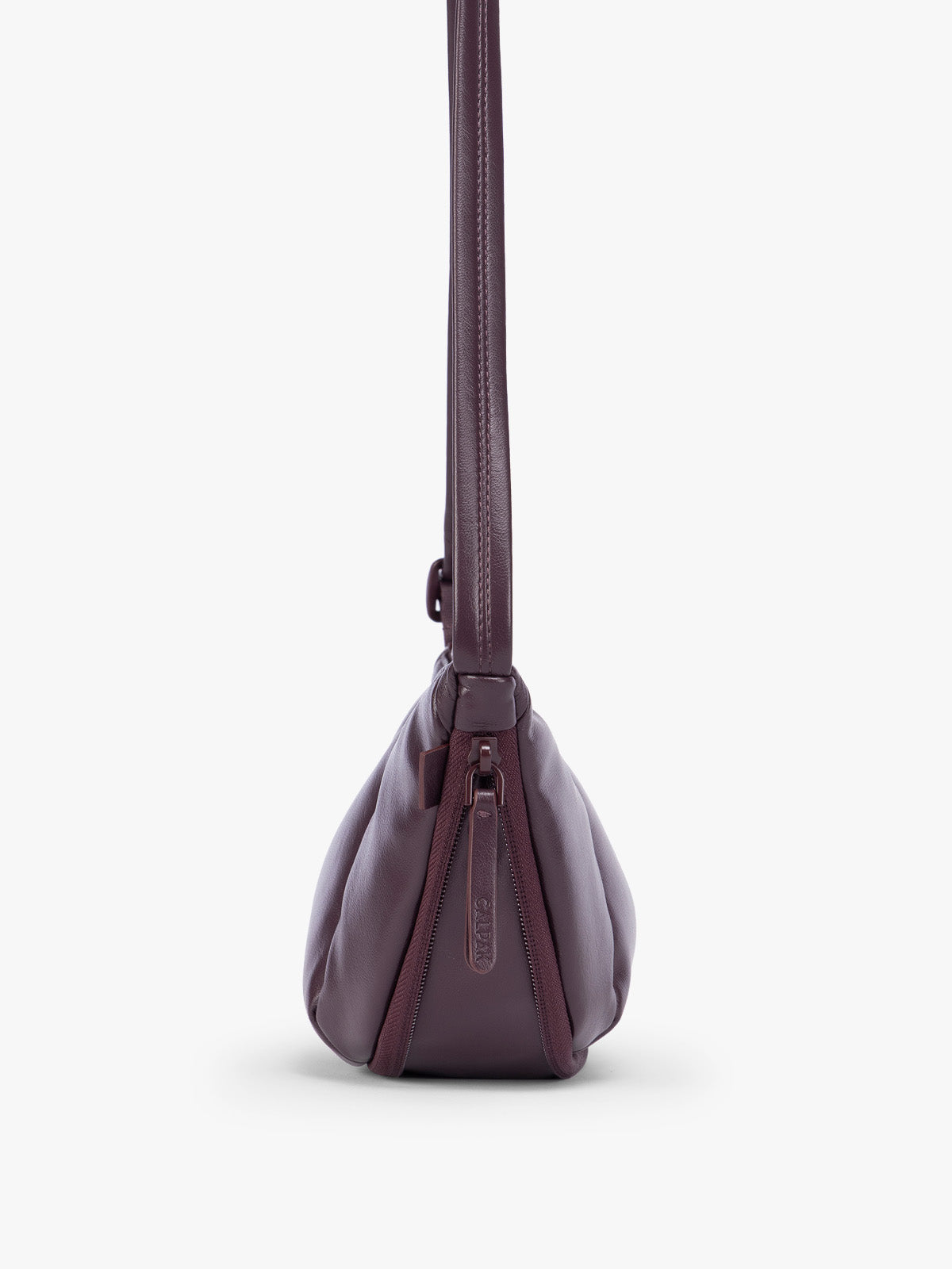 Side expandable zipper of Dark Cherry deep burgundy vegan leather Luka Crescent shoulder bag with a long thin strap, shown against a plain light gray background; CBL2601-DARK-CHERRY-PU