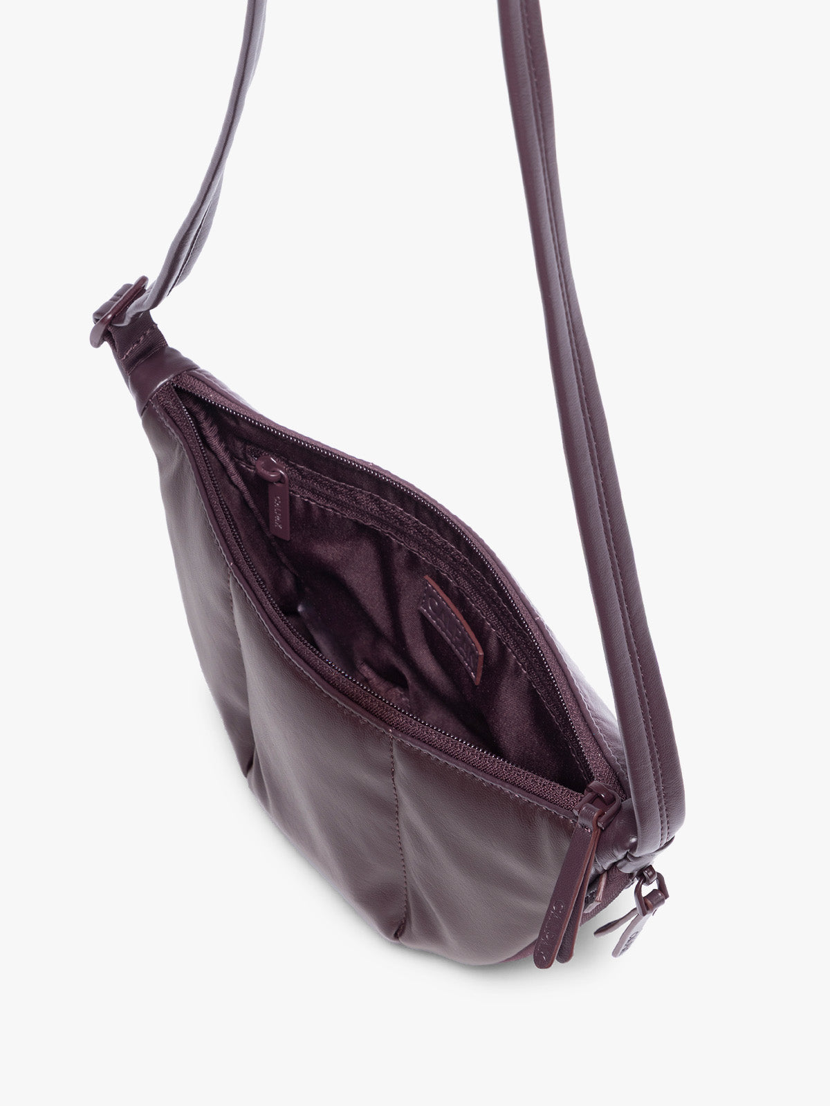 Top view of opened Dark Cherry deep burgundy vegan leather Luka Crescent shoulder bag with a long thin strap, shown against a plain light gray background; CBL2601-DARK-CHERRY-PU