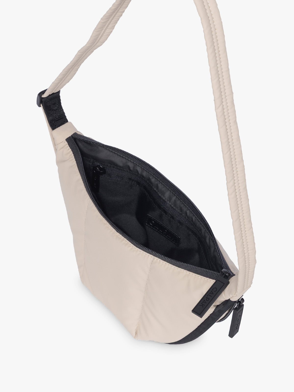 Opened CALPAK Luka Crescent Bag in beige off white Oatmeal; CBL2601-OATMEAL