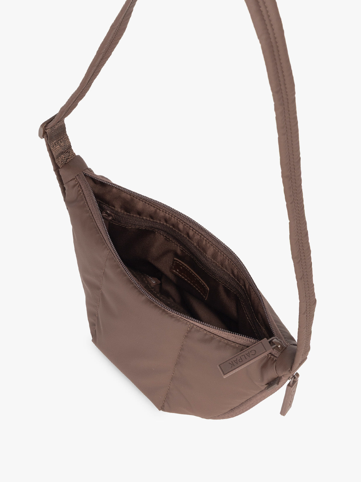 Opened interior of CALPAK Luka Crescent Tote bag in brown Walnut with shoulder strap and bag is expandable up to 2" on a white background; CBL2601-WALNUT