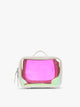 Person wearing beige holding a CALPAK Small Clear Cosmetic Case in Moonbeam with white border and transparent holographic iridescent makeup bag with pink on a white background; CCM2001-MOONBEAM