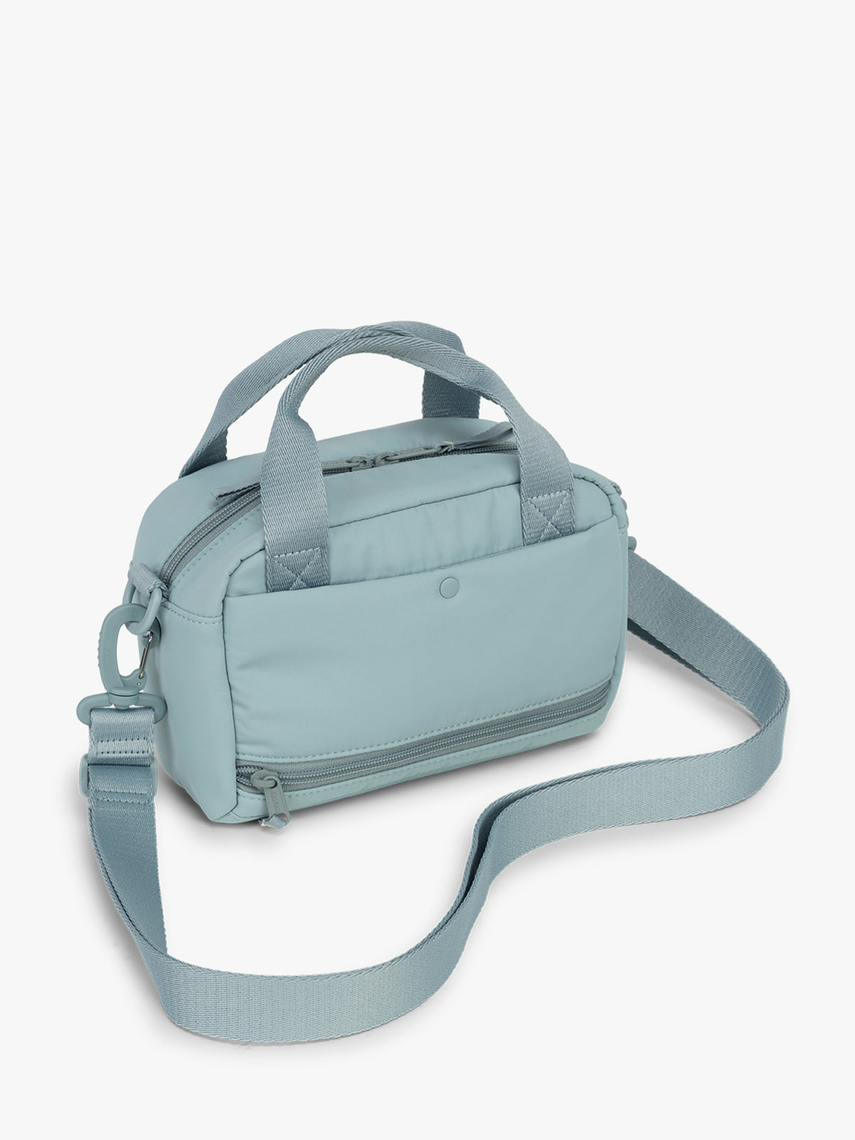 CALPAK Connect Crossbody Bag in beige light blue Bluebell with a shoulder strap on a white background; CCN2501-BLUEBELL