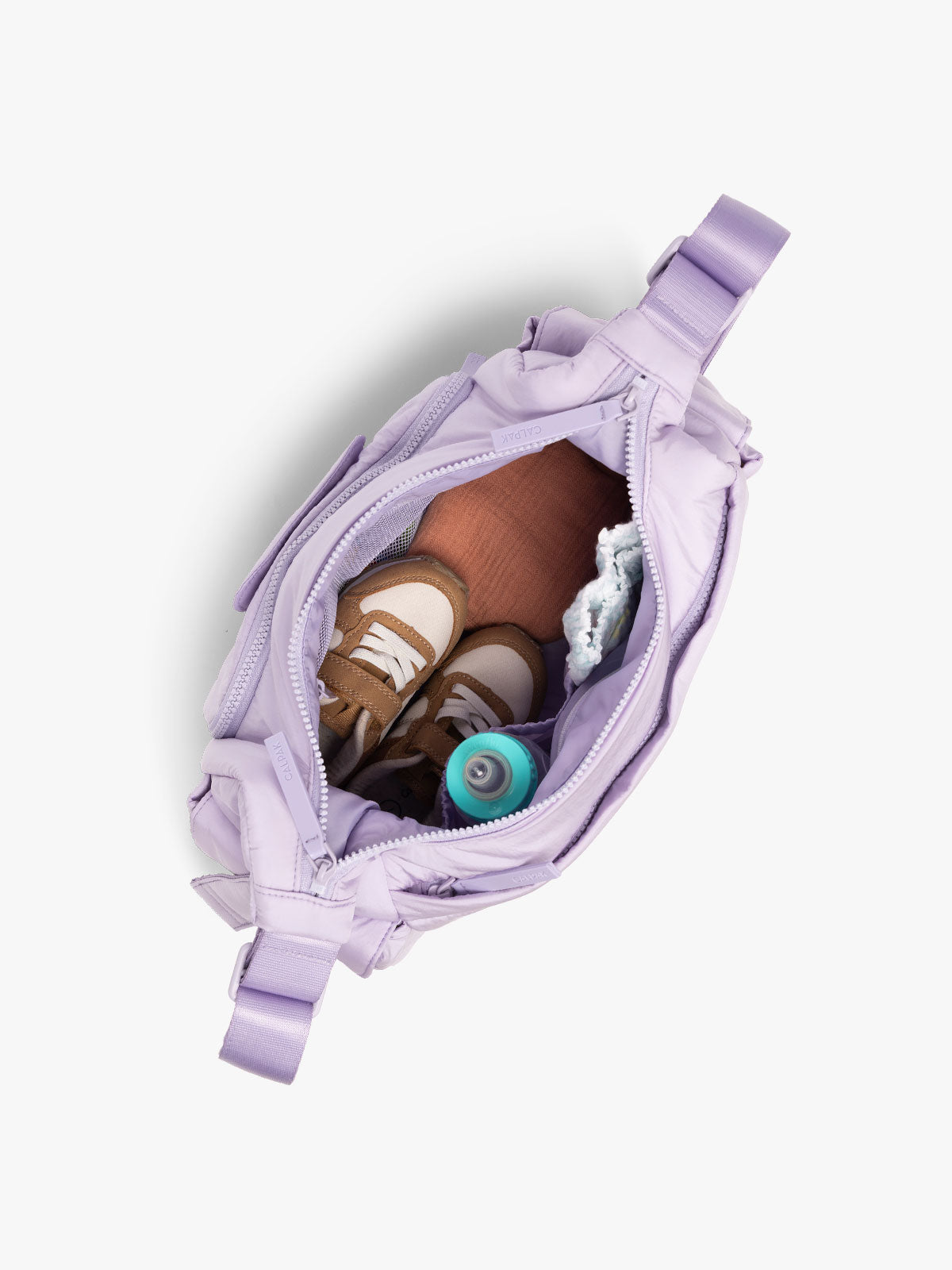 CALPAK Crossbody Diaper Bag in light purple Orchid top view with zipper opened, showing interior of bag; CDB2501-ORCHID