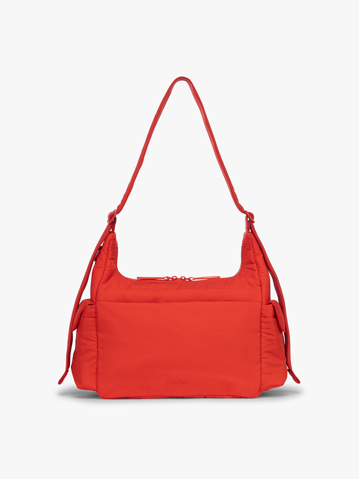 Backside of CALPAK Crossbody Diaper Bag in red Tomato; CDB2501-TOMATO