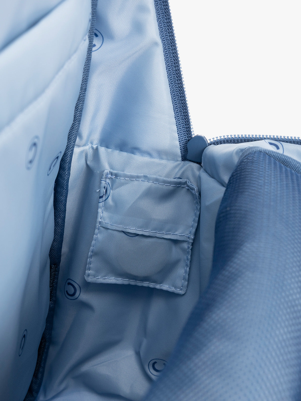 CALPAK Kids Large Backpack in Blue for ages 8-12 with tracking device pocket; CKBL2501-BLUE