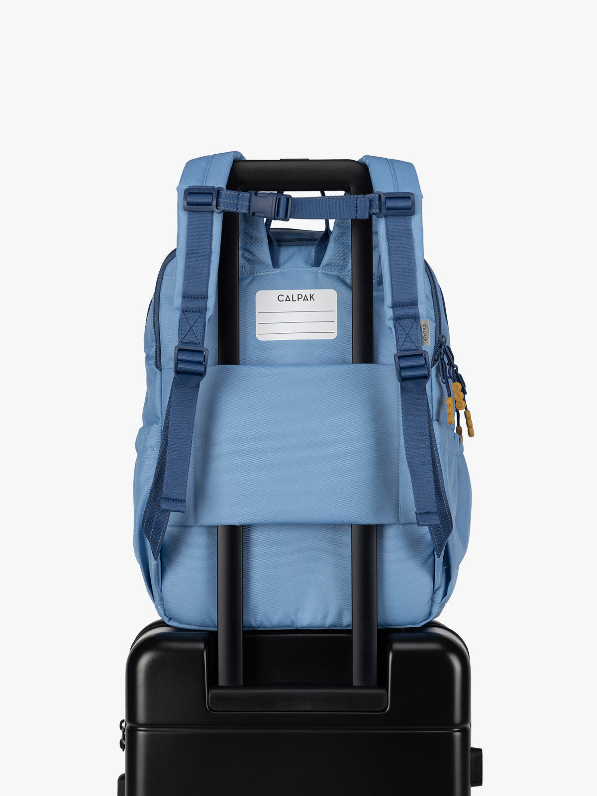 CALPAK Kids Large Backpack in Blue for ages 8-12 opened view with multiple interior pockets and blue lining; CKBL2501-BLUE