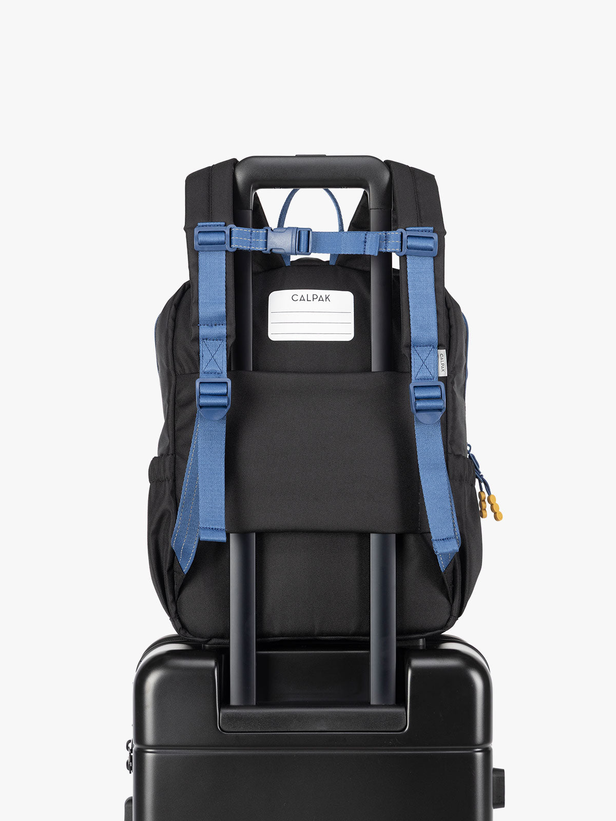 CALPAK Kids Medium Backpack in Black for ages 5-8 with back luggage trolley sleeve; CKBM2501-BLACK