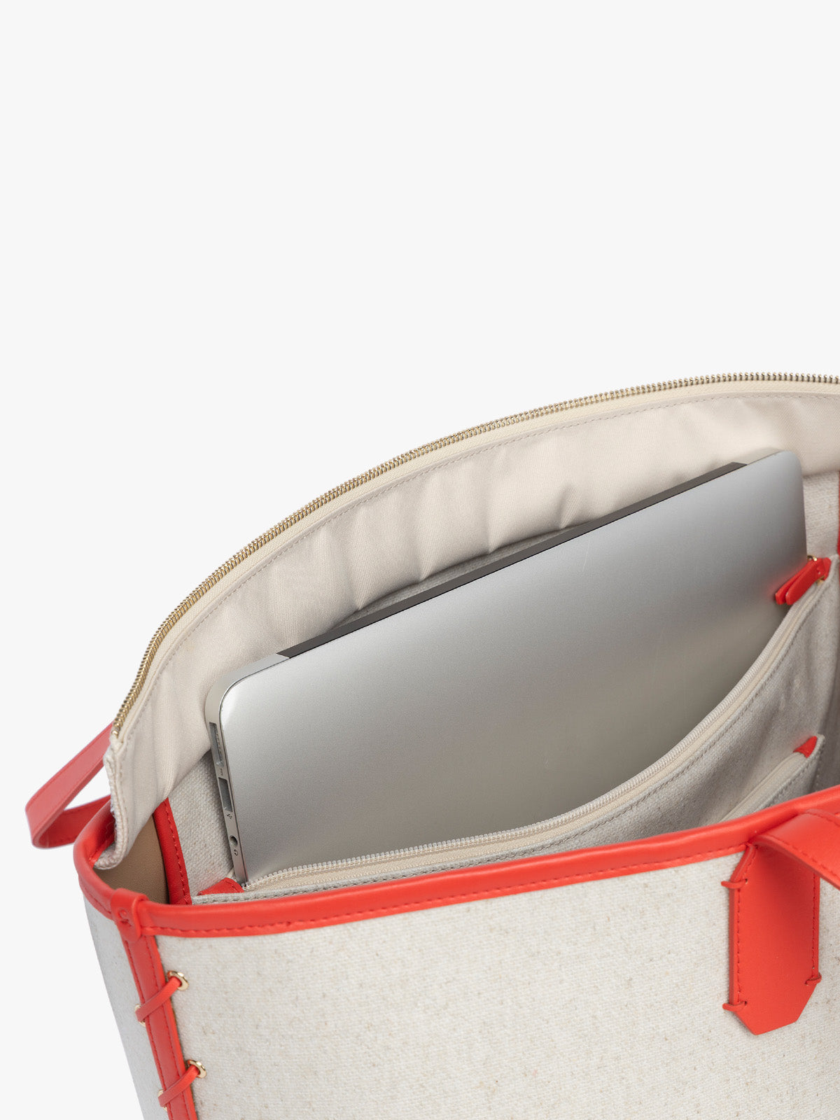 Laptop sleeve of CALPAK Colette 15" Canvas Laptop Tote with zipper and interior laptop sleeve in beige canvas material  with red finishing in Natural Tomato; CLCT2601-NATURAL-TOMATO