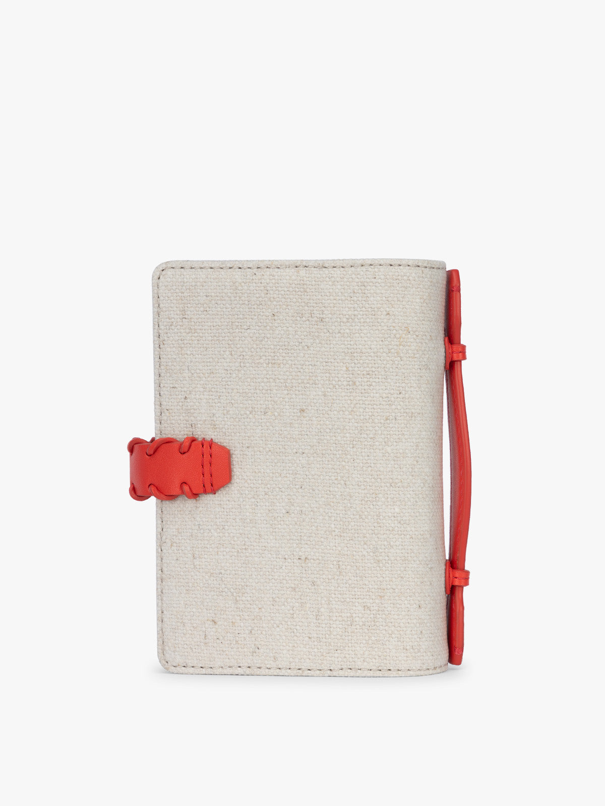 Backside of CALPAK Colette Multi Passport Wallet in beige canvas material and red finishings in Natural Tomato; CLPW2601-NATURAL-TOMATO