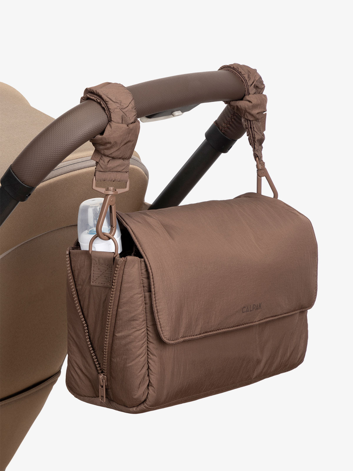 CALPAK Convertible Stroller Caddy Crossbody with included stroller straps in hazelnut brown; SCB2401-HAZELNUT