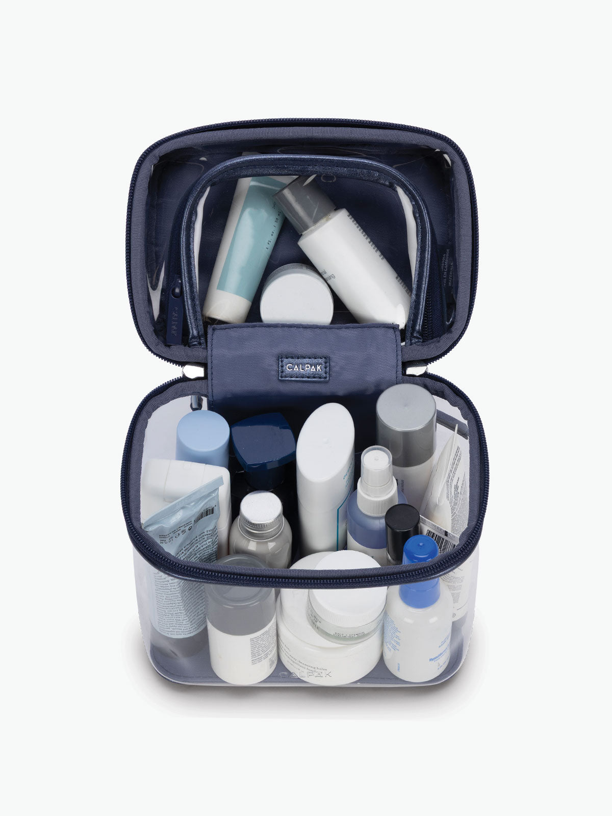 Toiletries in the CALPAK Clear Cosmetic Case in dark blue Metallic Blue; CTC2401-METALLIC-INDIGO