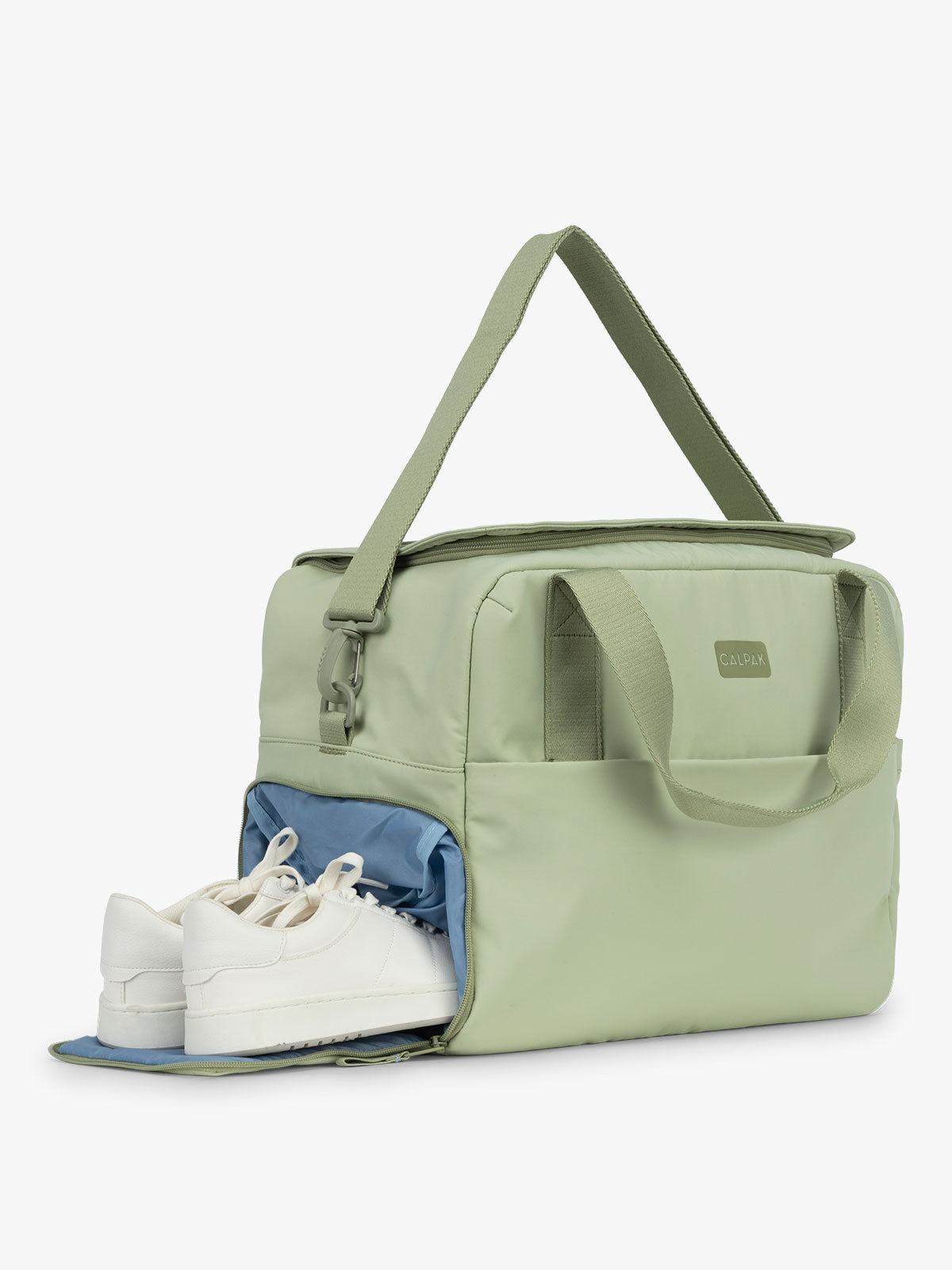 CALPAK Laptop Duffel in light green Meadow showing shoe compartment with white background; DCN2401-MEADOW