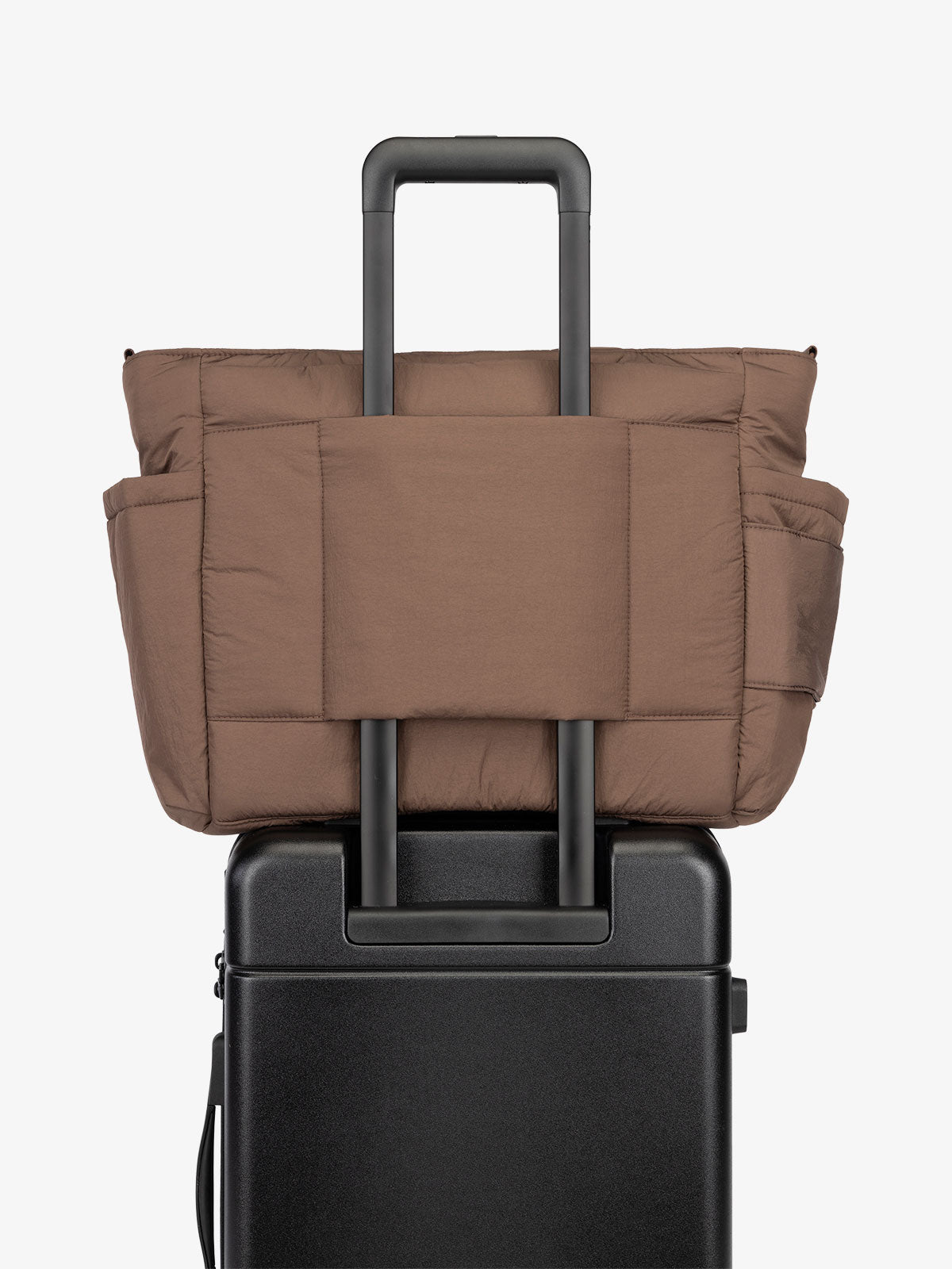 CALPAK Diaper Tote Bag with Laptop Sleeve featuring luggage trolley sleeve with back pocket in hazelnut brown; TBB2401-HAZELNUT