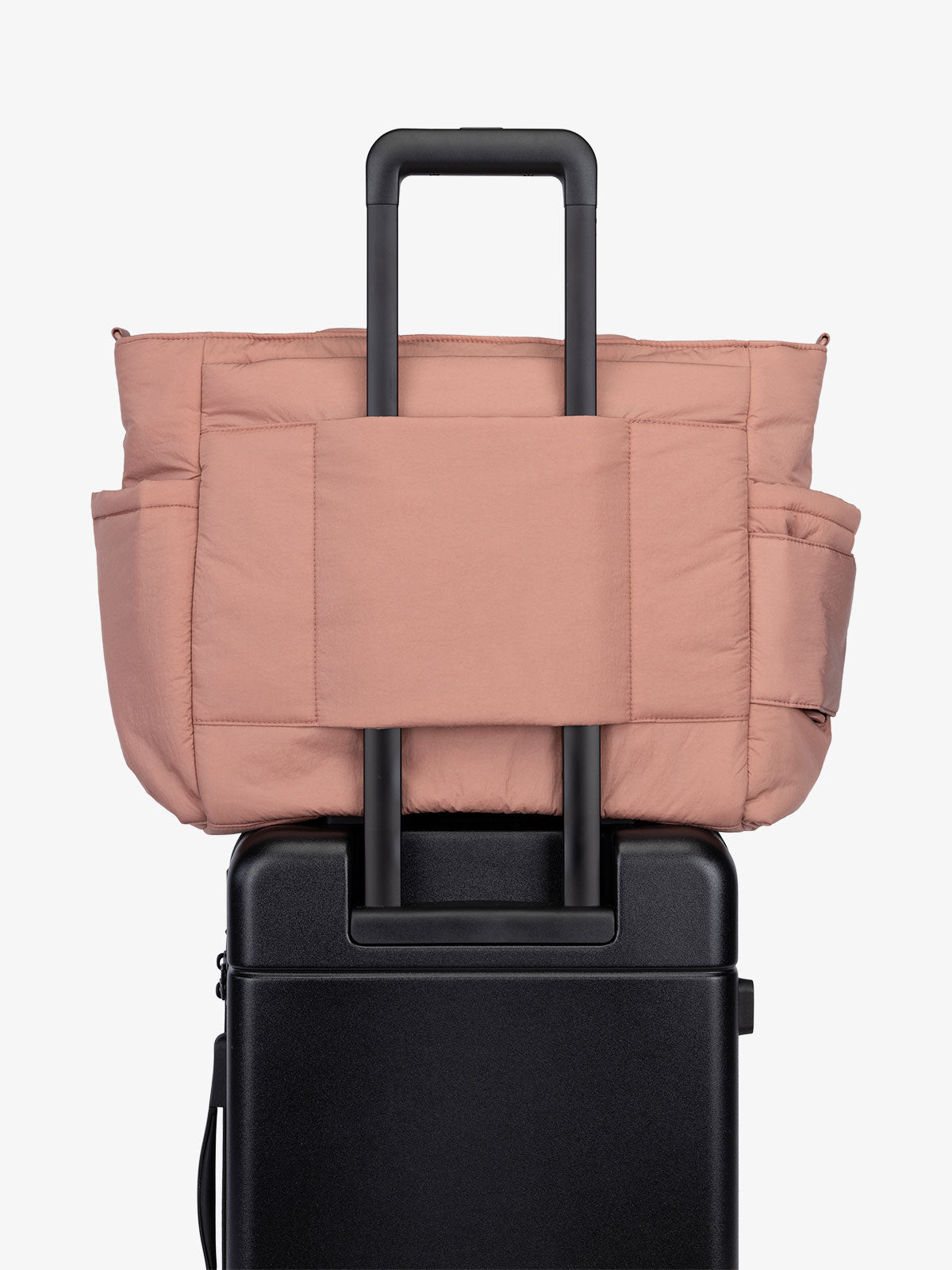 CALPAK Diaper Tote Bag with Laptop Sleeve featuring luggage trolley sleeve with back pocket in peony pink; TBB2401-PEONY