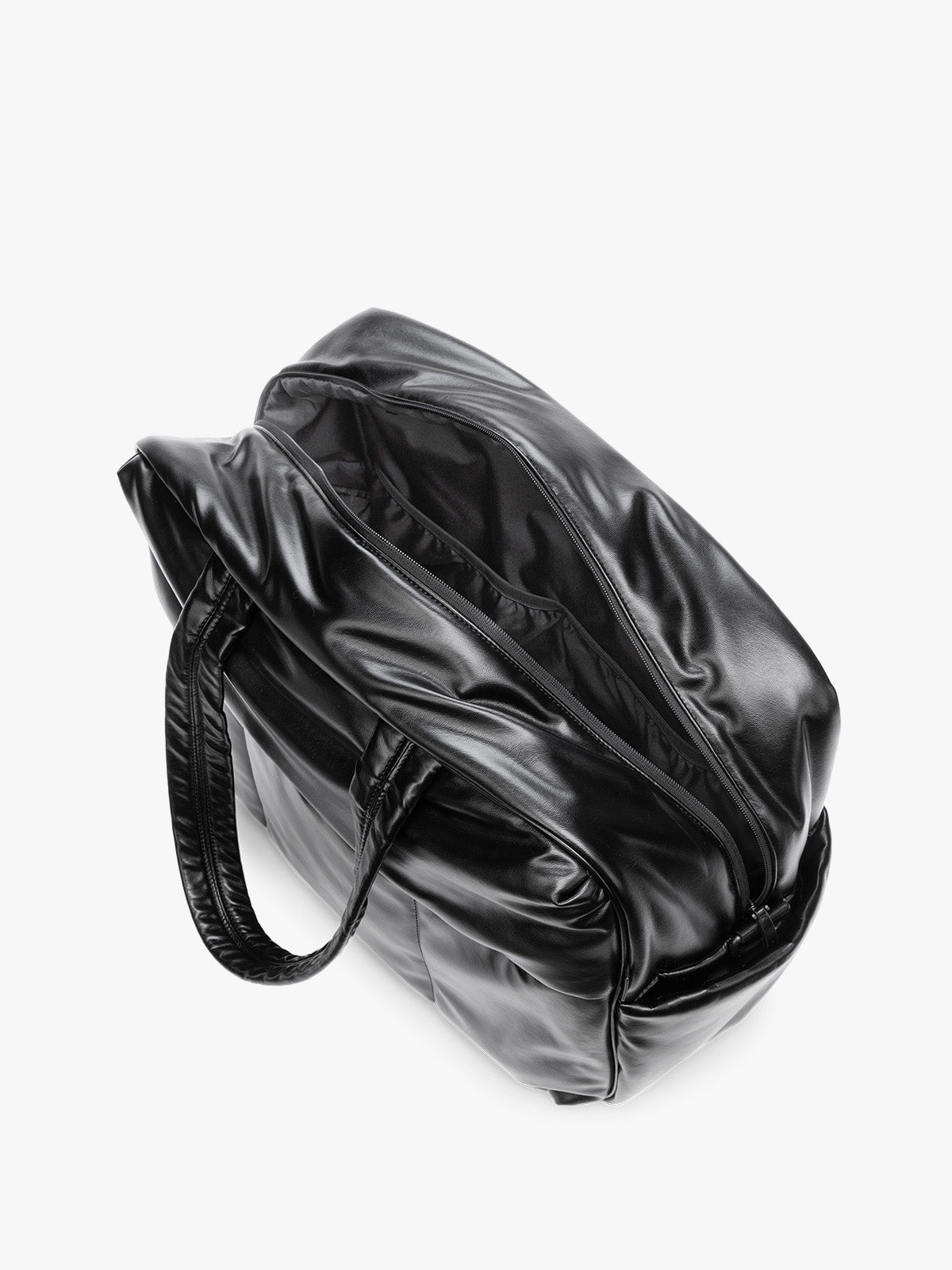Side view showing inside of Black CALPAK Luka Large Duffel in vegan leather with dual top handles, shown against a plain white background; DLL2201-BLACK-PU