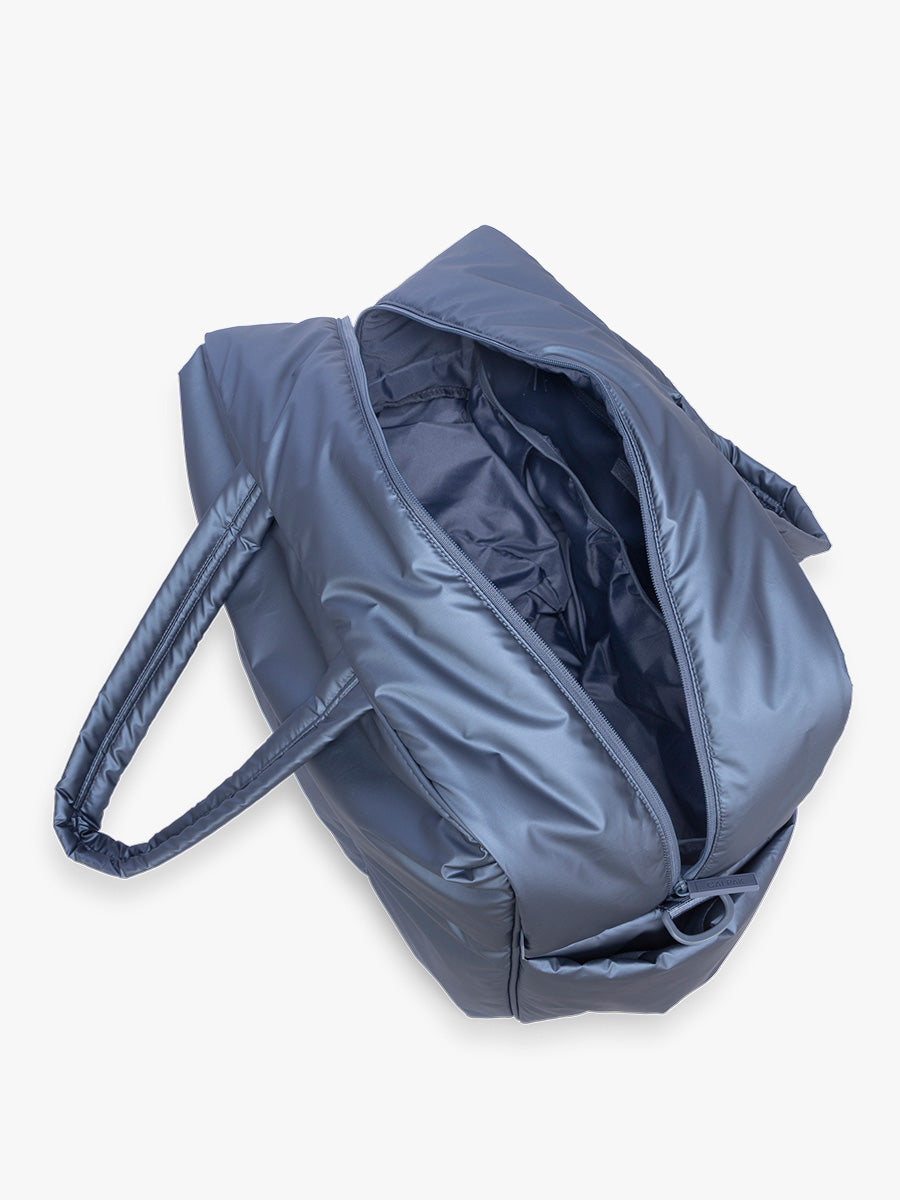 Opened interior view of CALPAK Luka Large Duffel in dark blue metallic material in Metallic Indigo; DLL2201-METALLIC-INDIGO