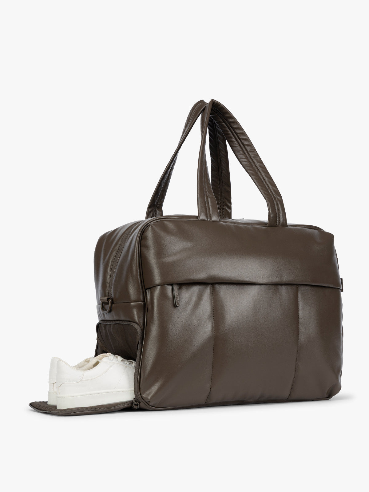 Side shoe compartment of Mushroom dark brown CALPAK Luka Large Duffel in vegan leather with dual top handles, shown against a plain white background; DLL2201-MUSHROOM-PU