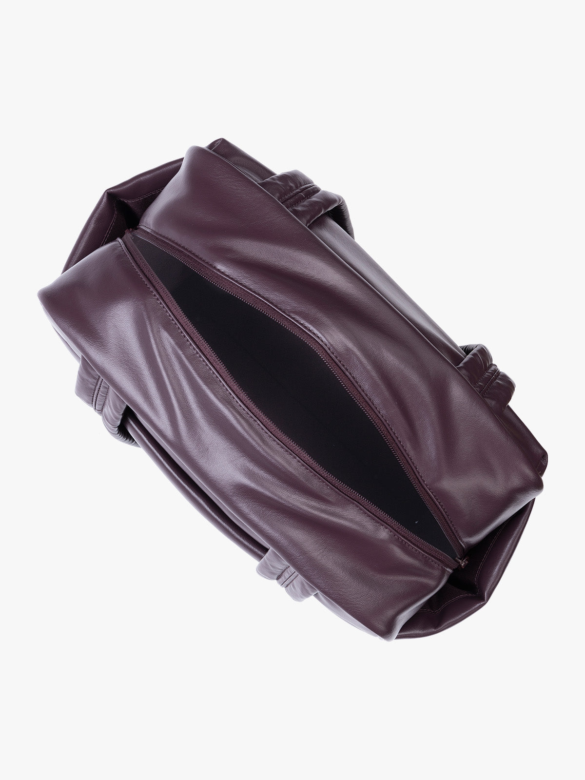 Top view of zipper opened Dark burgundy Dark Cherry vegan leather CALPAK Luka Mini Duffel with dual top handles and side pockets, photographed against a clean white background; DLM2501-DARK-CHERRY-PU