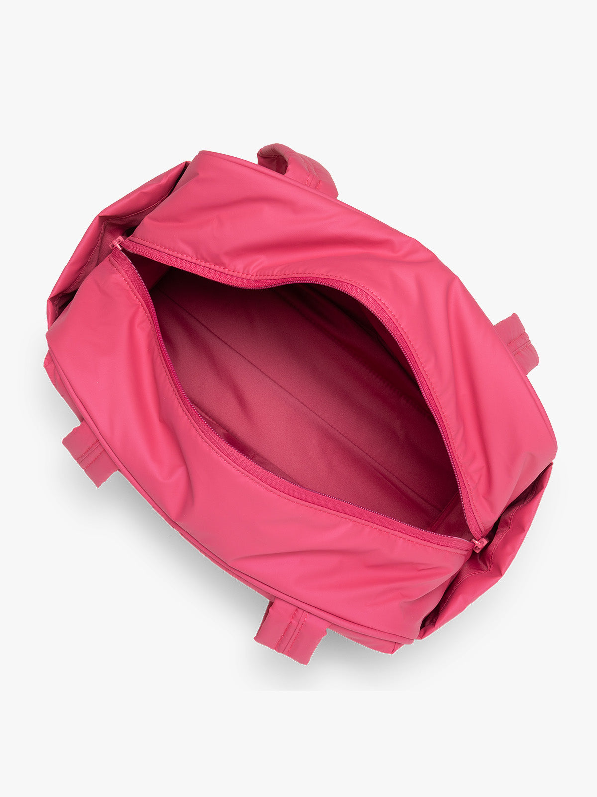 Opened interior of CALPAK Luka Mini Duffel in bright pink on a white background; DLM2501-DRAGONFRUIT