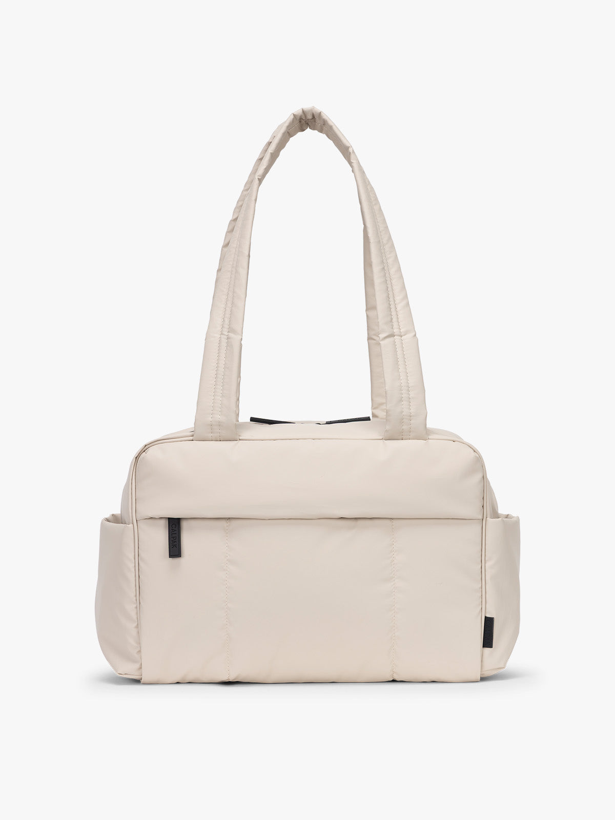 CALPAK Mini Duffel in white Oatmeal front view with puffy exterior, interior and exterior pockets, and padded shoulder straps; DLM2501-OATMEAL
