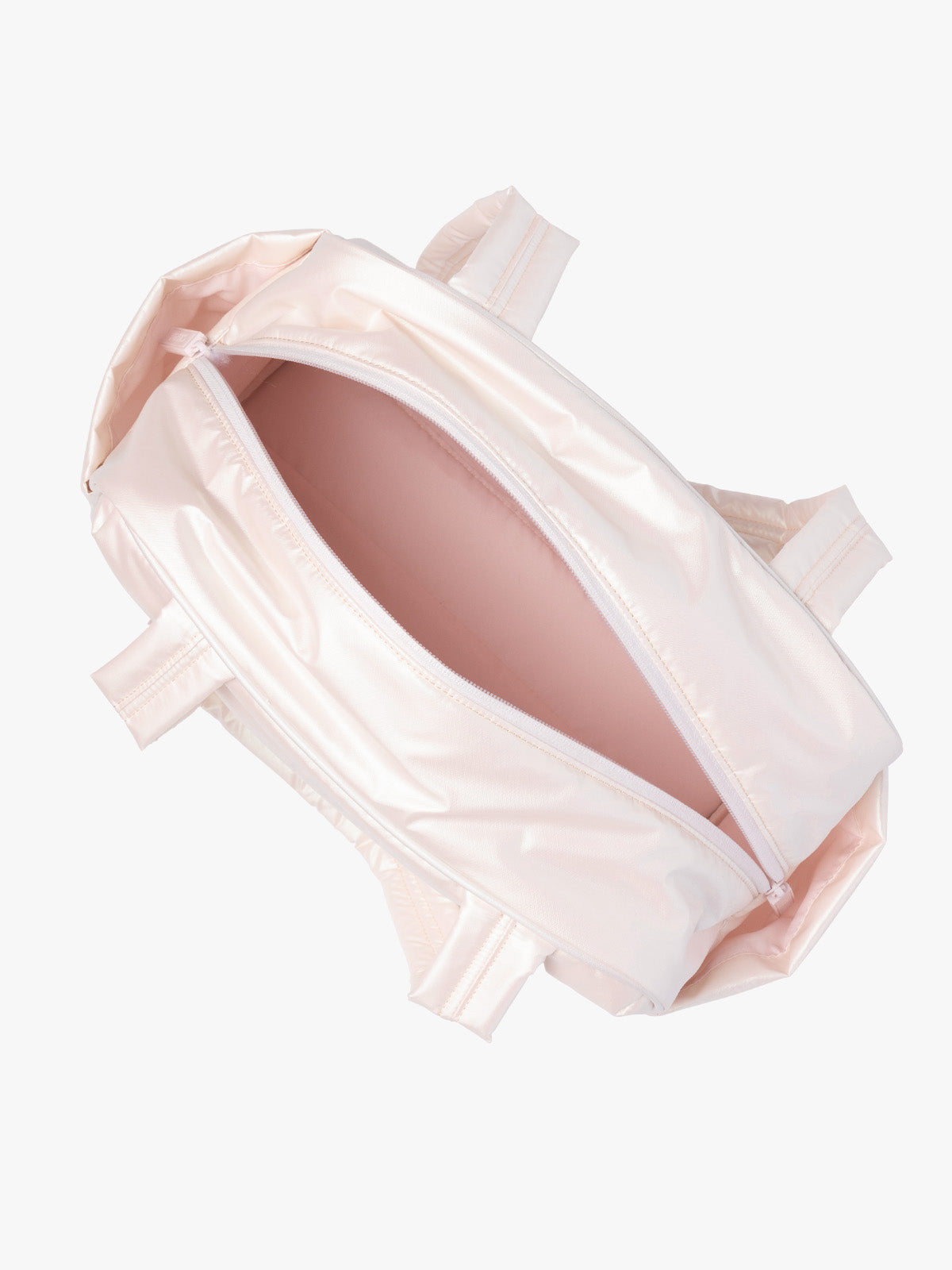 Opened CALPAK Luka Mini Duffel in light pink shiny Pearlescent; DLM2501-PEARLESCENT