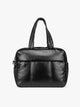 A Black CALPAK Luka Duffel in vegan leather with dual top handles and a front zippered pocket, photographed against a clean white background; DSM1901-BLACK-PU