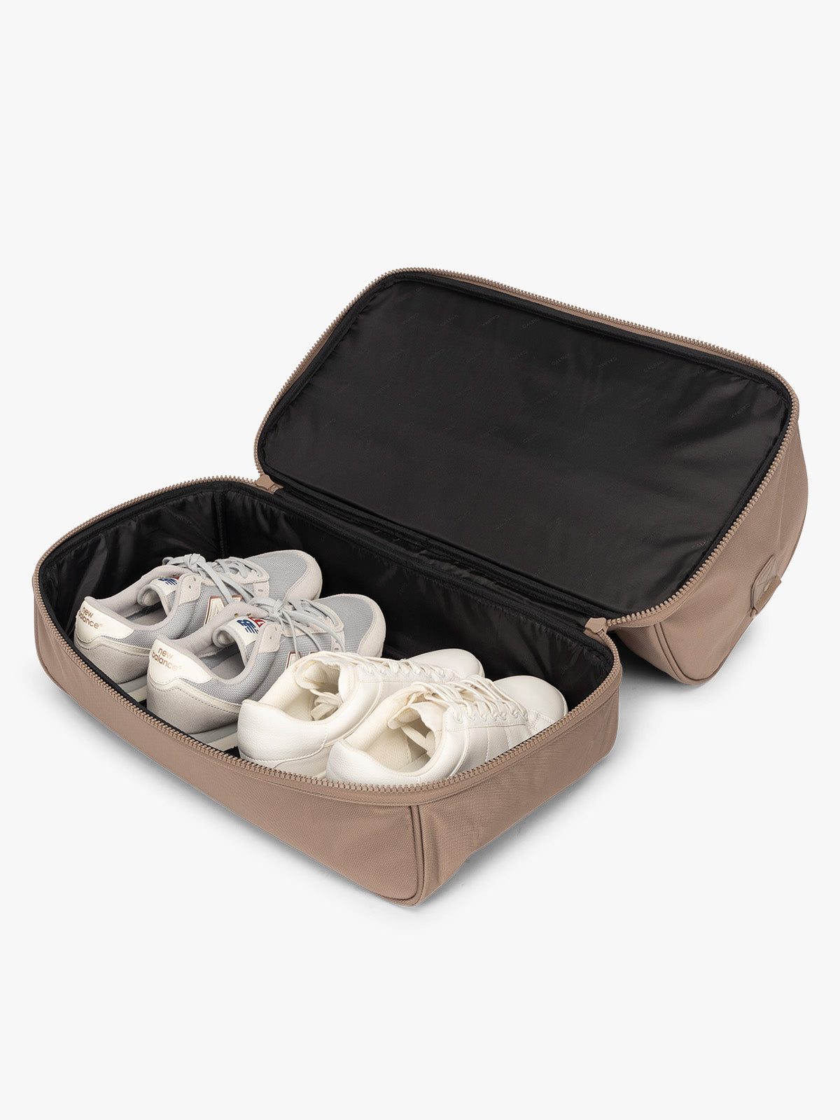 Shoe compartment of CALPAK Stevyn Duffel with Shoe Compartment in brown Chocolate; DST7019-CHOCOLATE