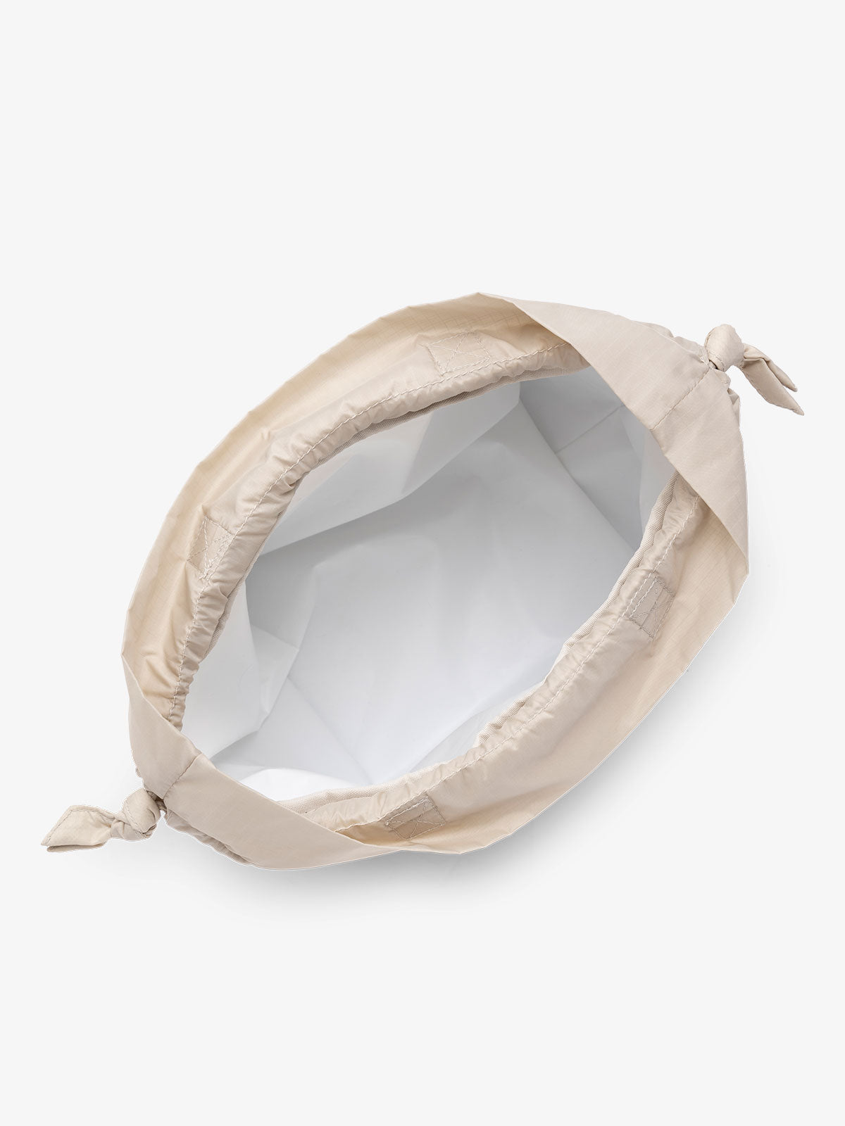 CALPAK Lunch Bag insulated with water resistant interior and drawstring closure in beige oatmeal; ALB2001-OATMEAL
