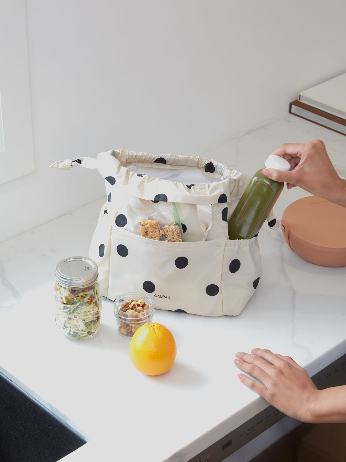 CALPAK insulated black and white polka dotted lunch cooler bag; ALB2001-POLKA-DOT