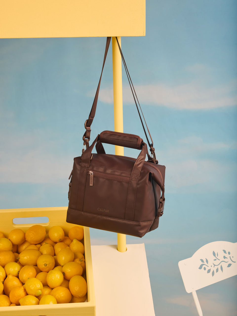 CALPAK Insulated 8L Soft-Sided Cooler in brown Walnut hanging on lemonade stand; ISCS2401-WALNUT