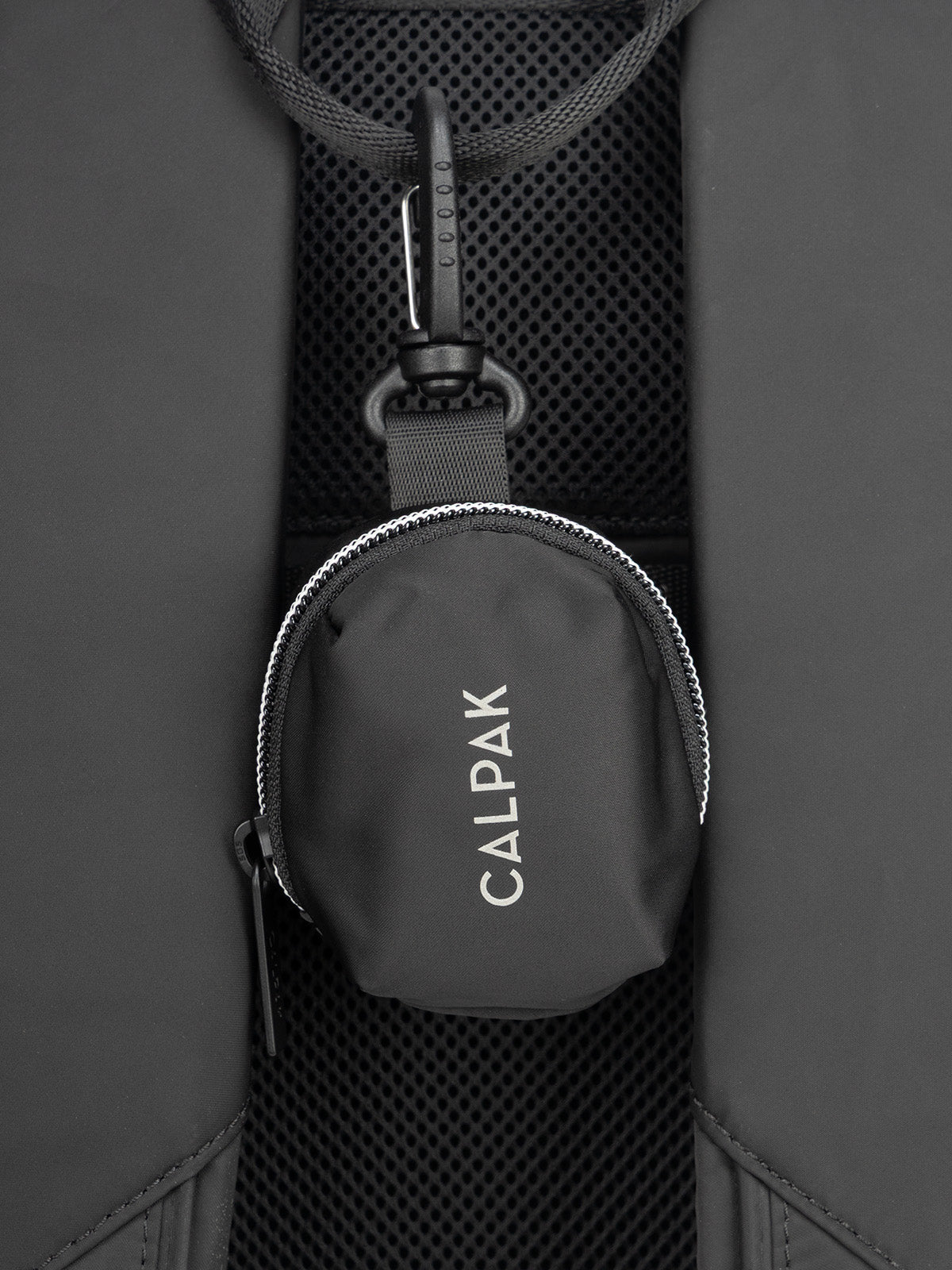 CALPAK Fit Zip Bag Charm in Black with hook and zipper hooked on bag; KPF2601-BLACK