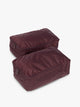 Closed zipper view of the burgundy Dark Cherry rectangular CALPAK shoe cube with zippers and top handle shown on a plain background; KSB2001-DARK-CHERRY