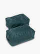 Closed zipper view of the dark green teal Kale rectangular CALPAK shoe cube with zippers and top handle shown on a plain background; KSB2001-KALE
