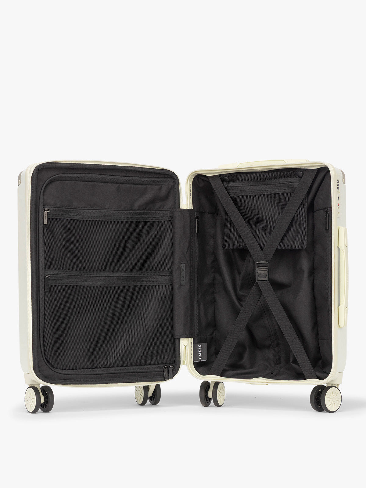 Opened CALPAK Ambeur 3 piece Luggage Set in light green Celadon with sizes of Carry On, Medium, and Large; LAM3000-CELADON