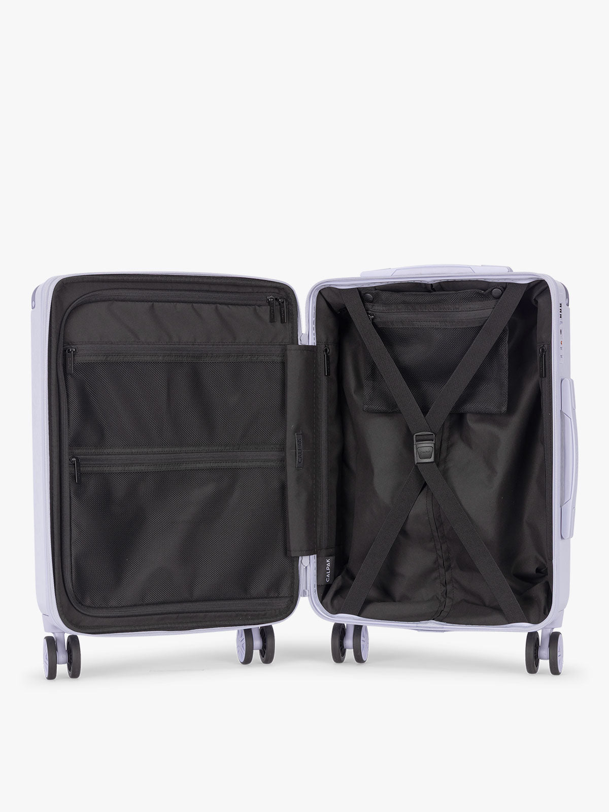 Opened CALPAK Ambeur three piece luggage set in carry on, medium, and large sizes in light purple lavender with handles and spinner wheels on a white background; LAM3000-SEA-GLASS