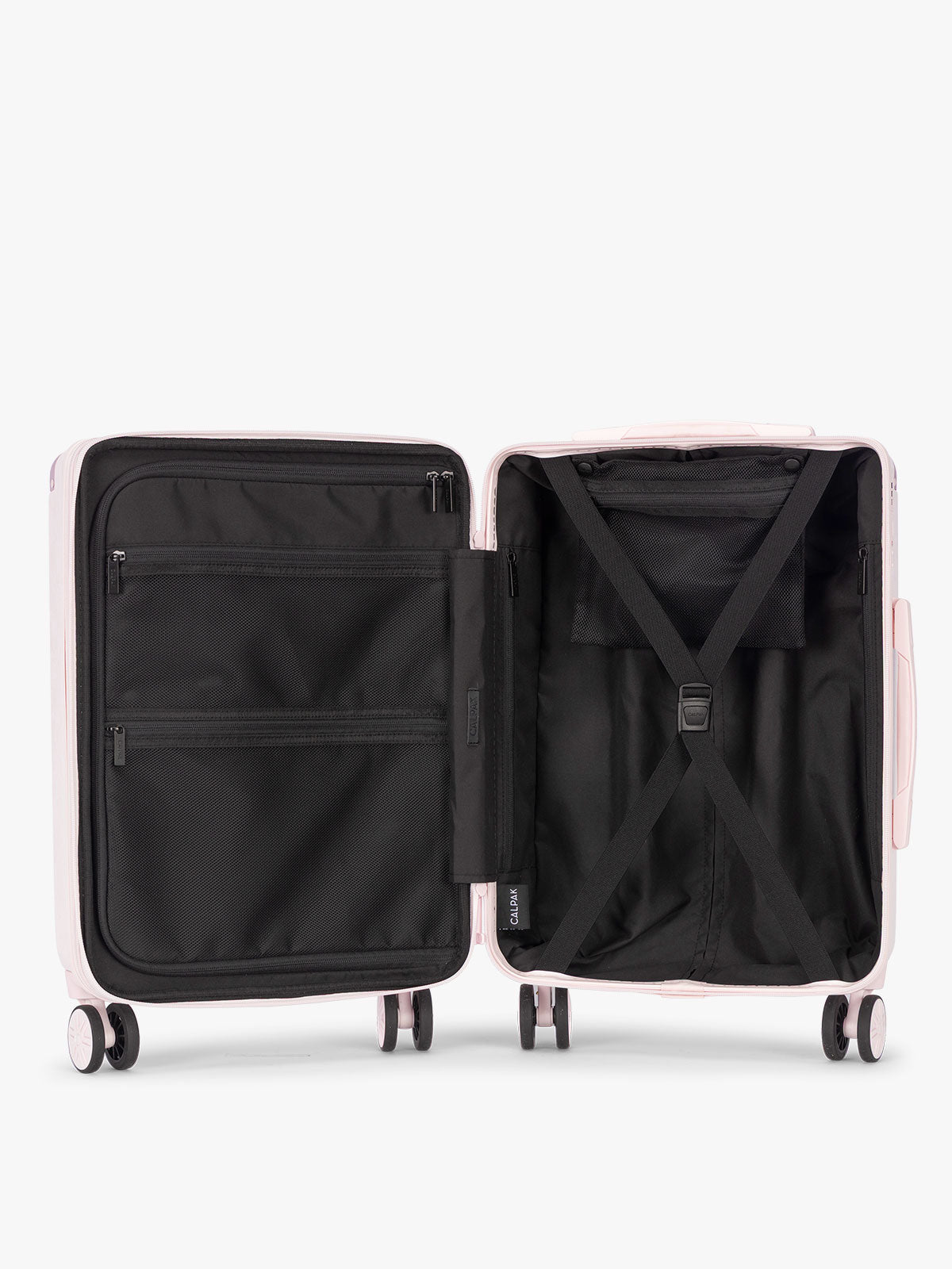 Opened CALPAK Ambeur Carry On Luggage in light pink Shell Pink with handles and wheels; LAM1020-SHELL-PINK