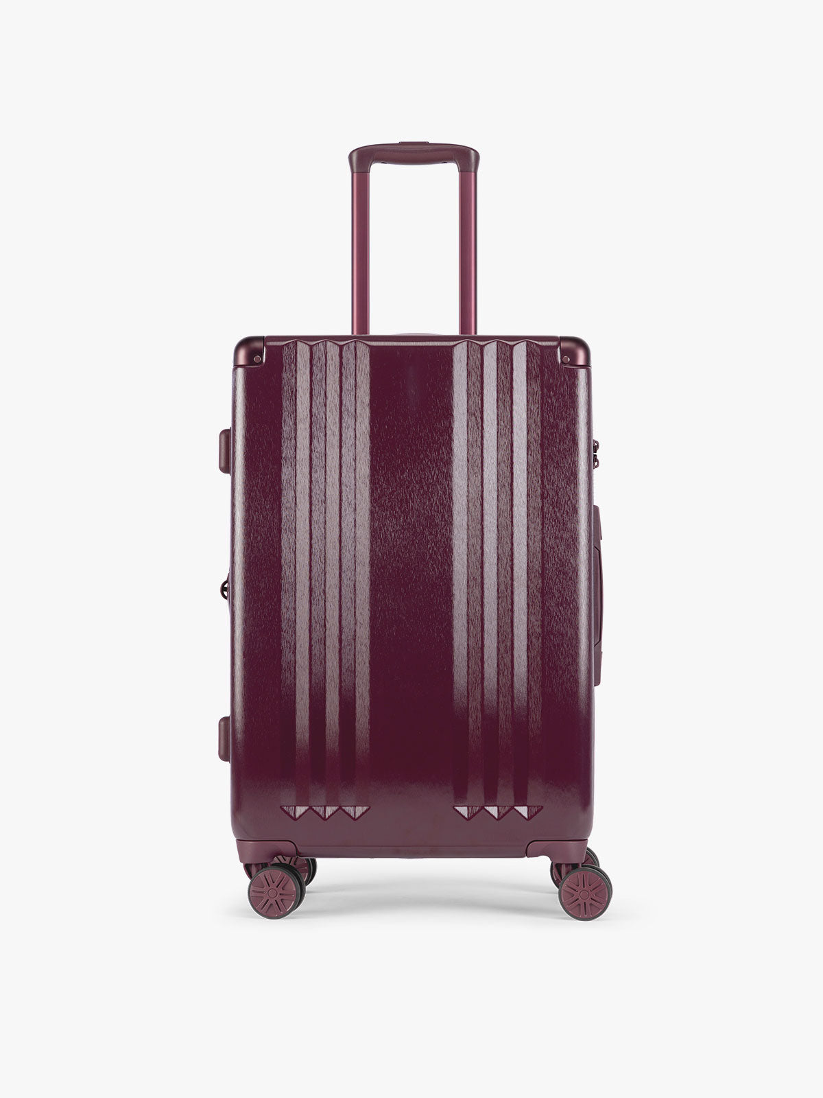 CALPAK Ambeur Medium Luggage in dark burgundy Dark Cherry with vertical ribbed detailing and an extended telescoping handle, shown from the front against a plain white background; LAM1024-DARK-CHERRY
