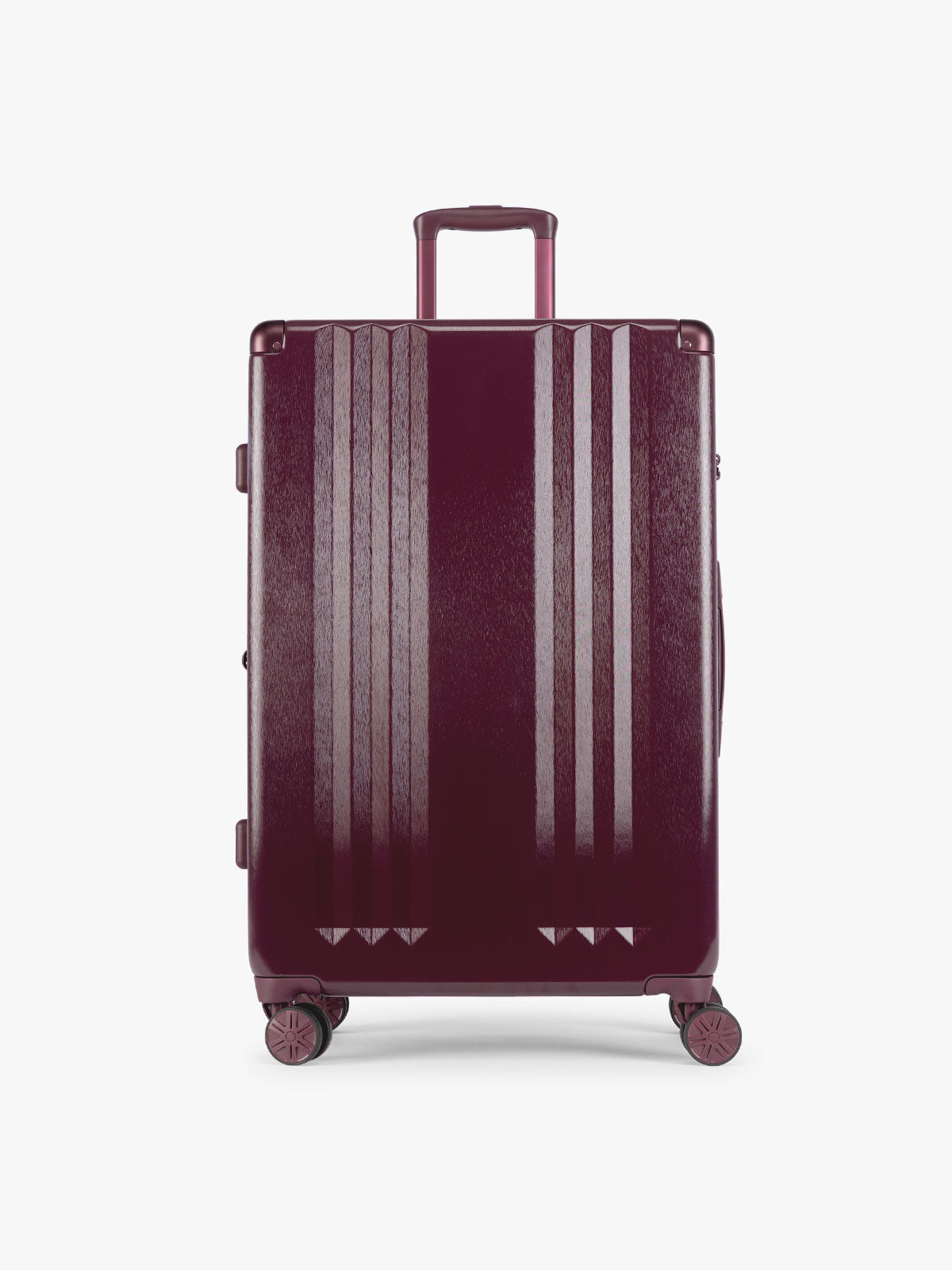 CALPAK Ambeur Large Luggage in dark burgundy Dark Cherry with vertical ribbed detailing and an extended telescoping handle, shown against a plain white background; LAM1028-DARK-CHERRY
