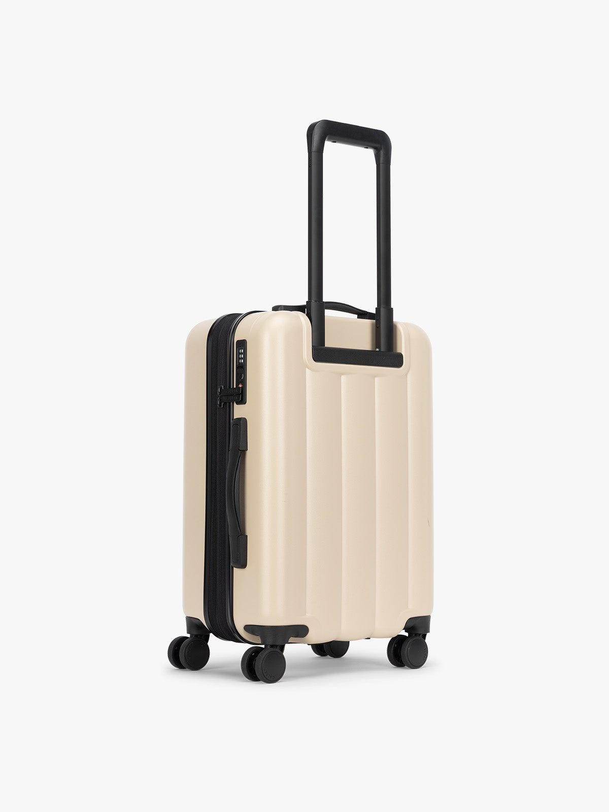 Backside of CALPAK Evry Carry-On Luggage in beige exterior and polka dot interior Polka Dot; LCO1020-POLKA-DOT