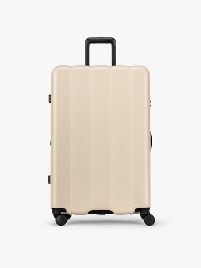 CALPAK Evry Large Luggage in beige exterior and interior polka dot in Polka Dot; LCO1028-POLKA-DOT