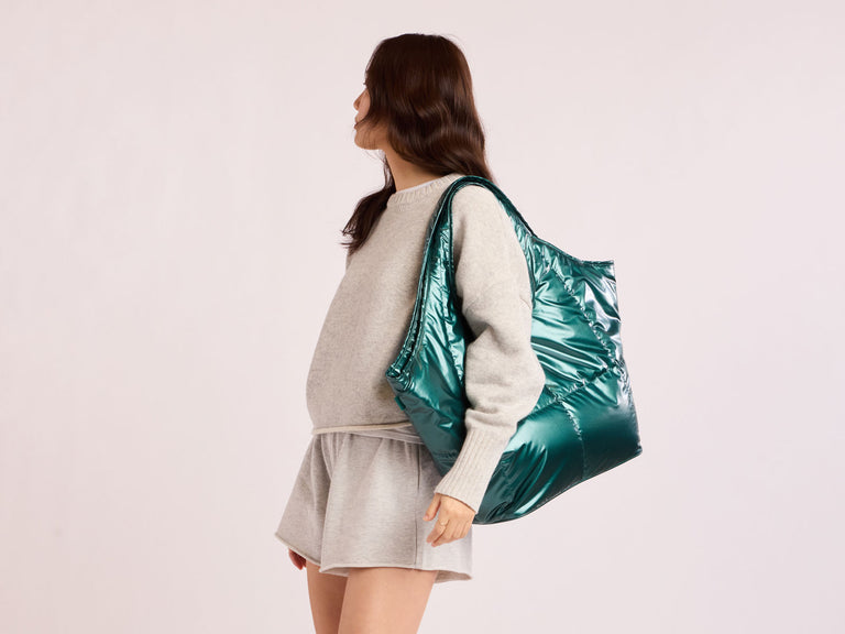 Model wearing Glazed Kale CALPAK Everything Laptop Tote Bag over shoulder