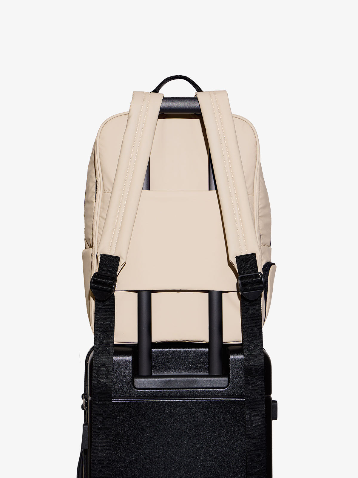 CALPAK laptop backpack for 17 inch laptop with adjustable shoulder straps and trolley pass through with hidden pocket in oatmeal beige; BPX2301-OATMEAL