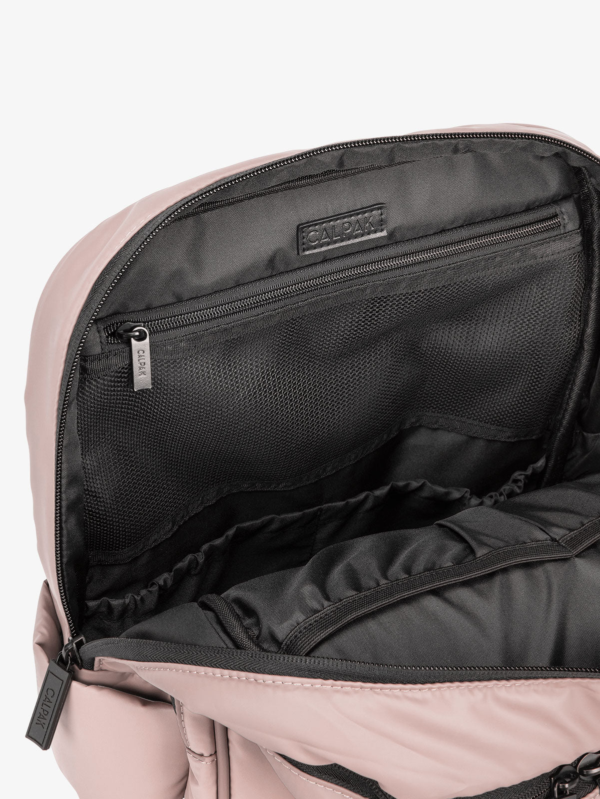 Close up of main compartment of CALPAK laptop backpack with multiple interior pockets in pink rose quartz; BPX2301-ROSE-QUARTZ