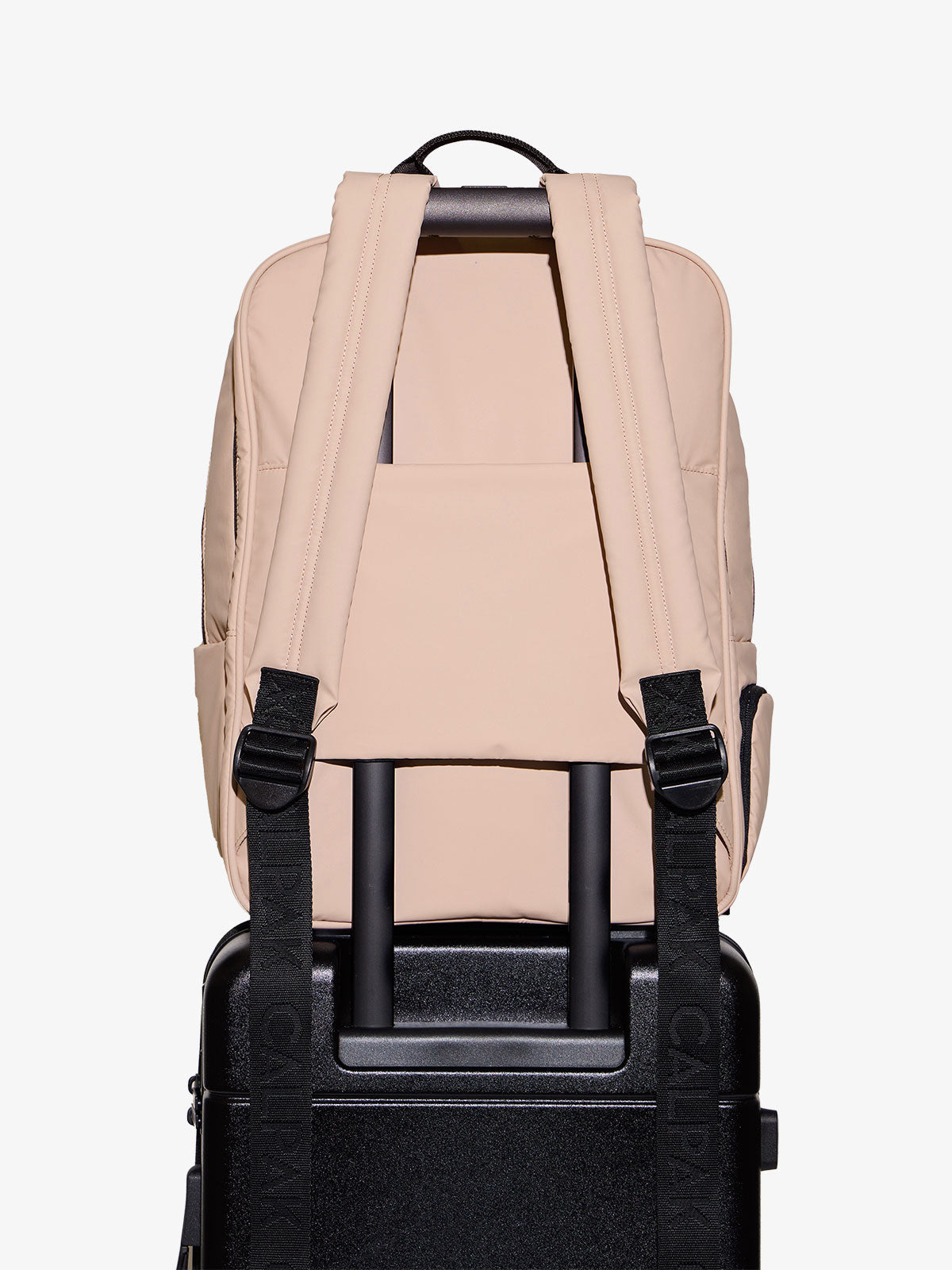 CALPAK laptop backpack for 17 inch laptop with adjustable shoulder straps and trolley pass through with hidden pocket in pink rose quartz; BPX2301-ROSE-QUARTZ