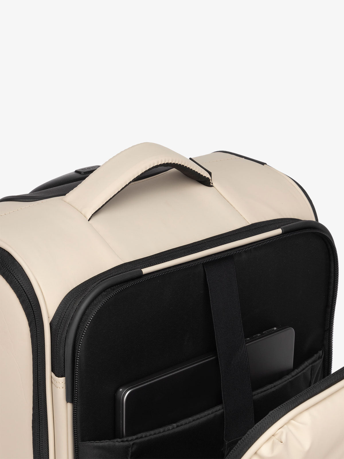 CALPAK Luka soft sided carry on luggage with top handle and padded laptop compartment in oatmeal; LSM1020-OATMEAL
