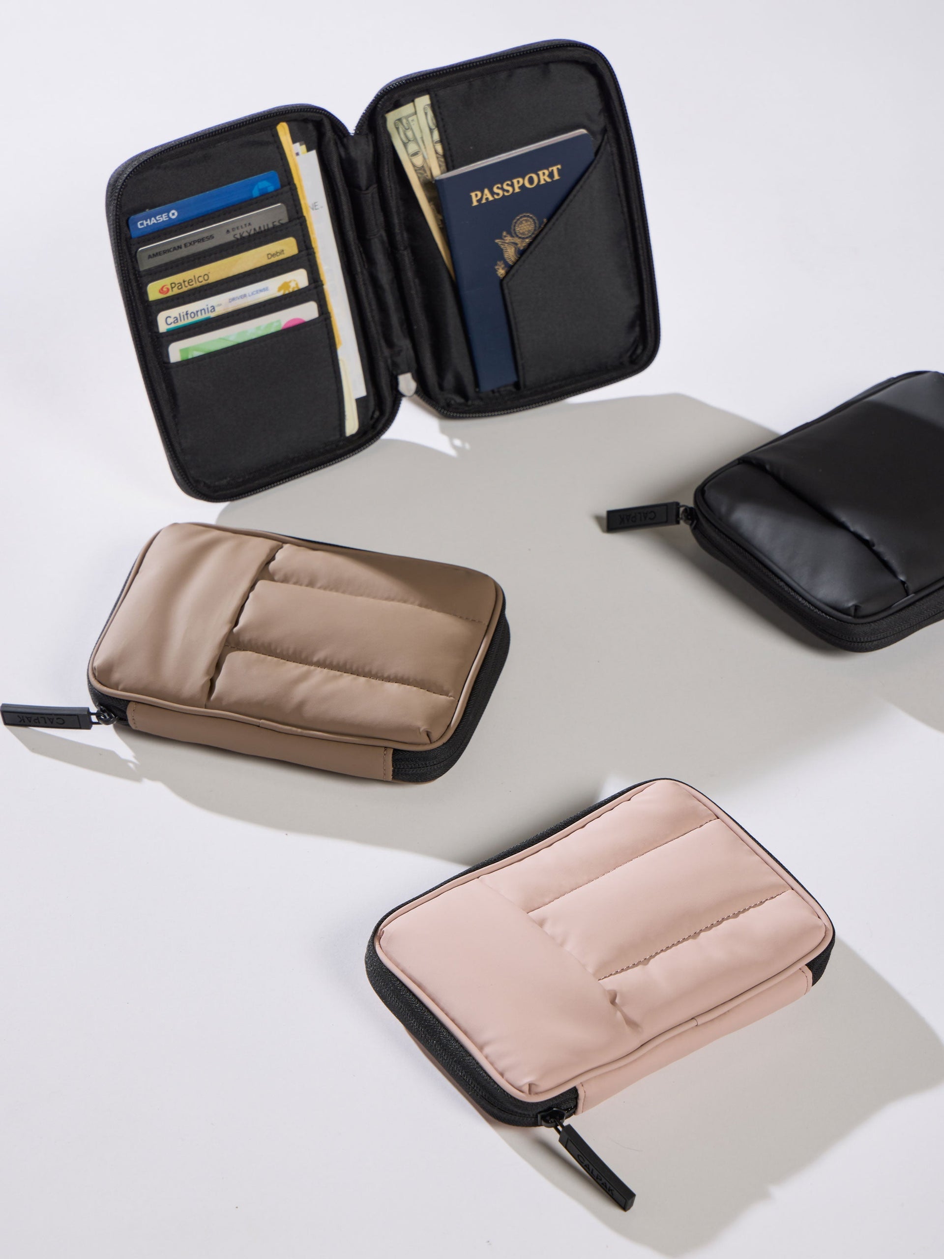 CALPAK Luka Zippered Passport Wallet in chocolate, matte black and rose quartz; PZW2301-MATTE-BLACK